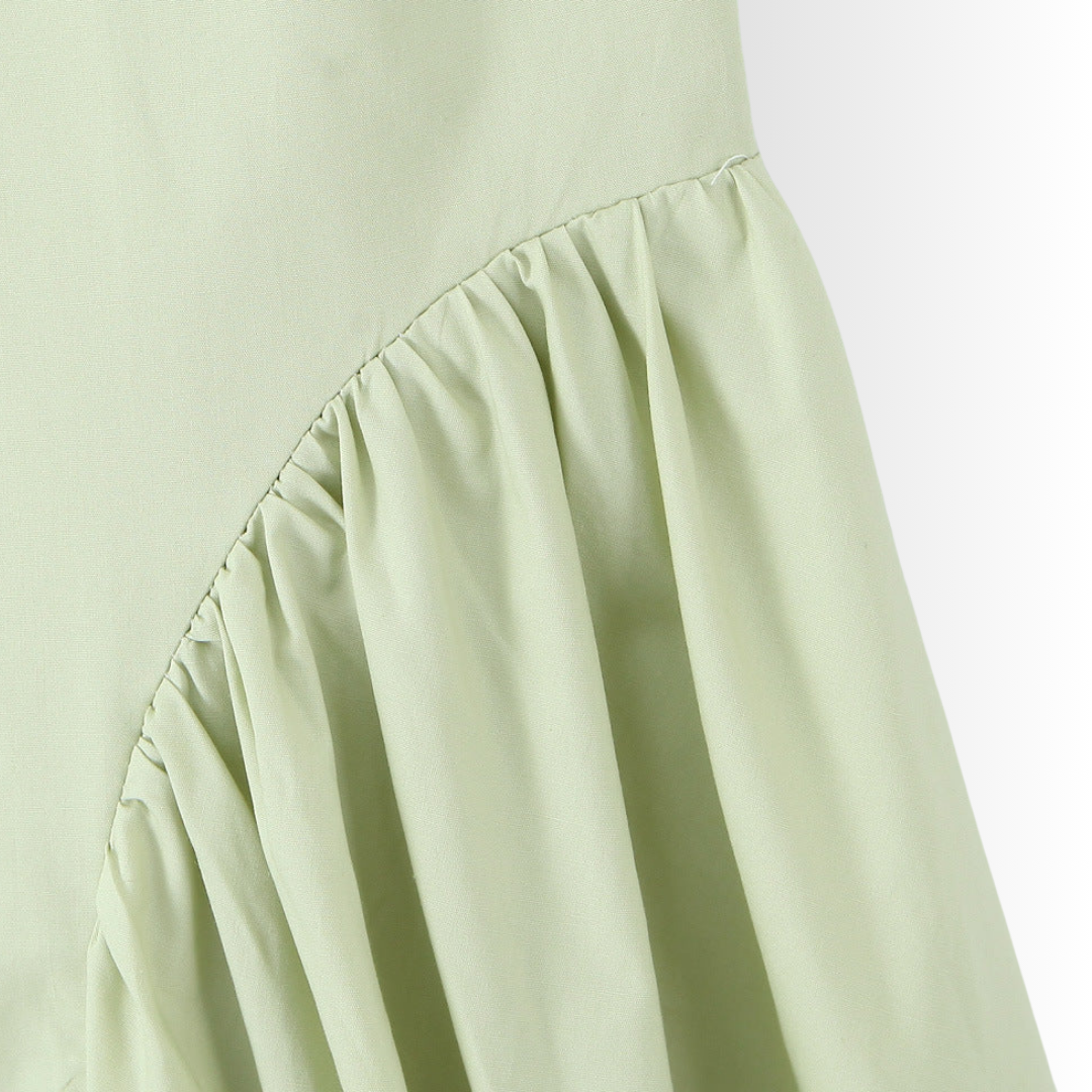 zoom view of green midi dress with tie-back halter
