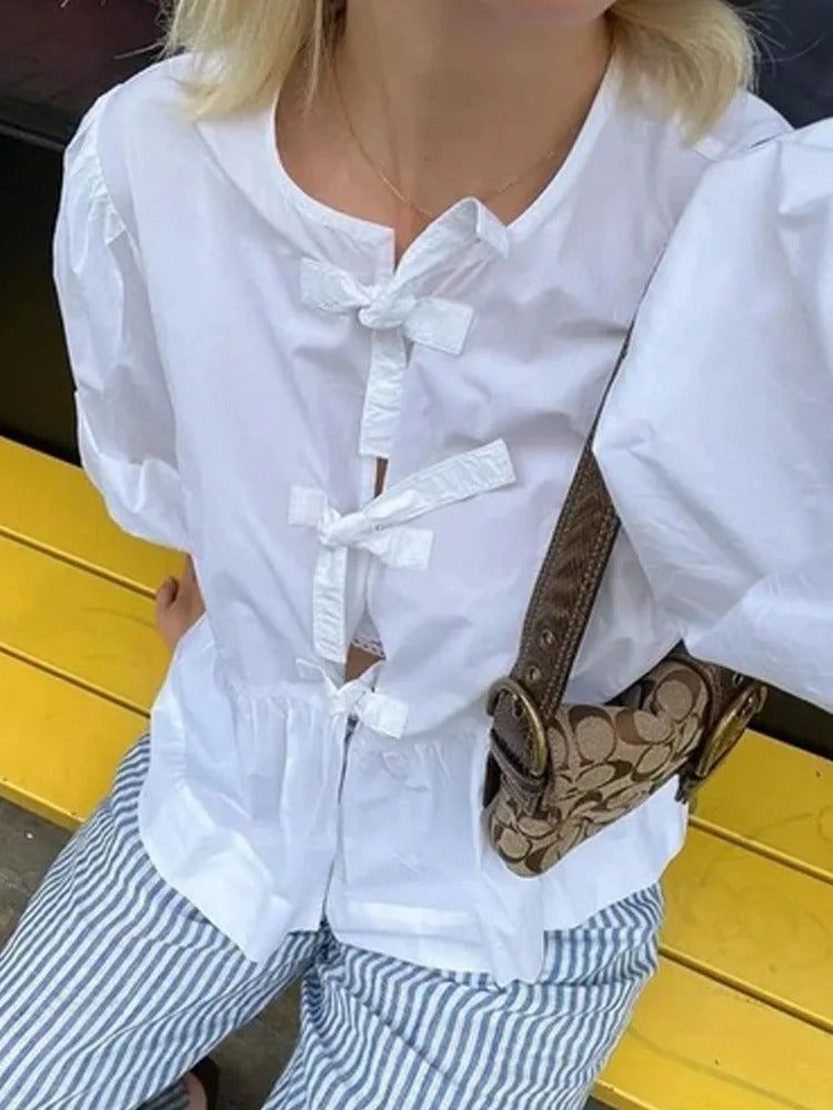 White blouse for women with puff sleeves and front bow ties