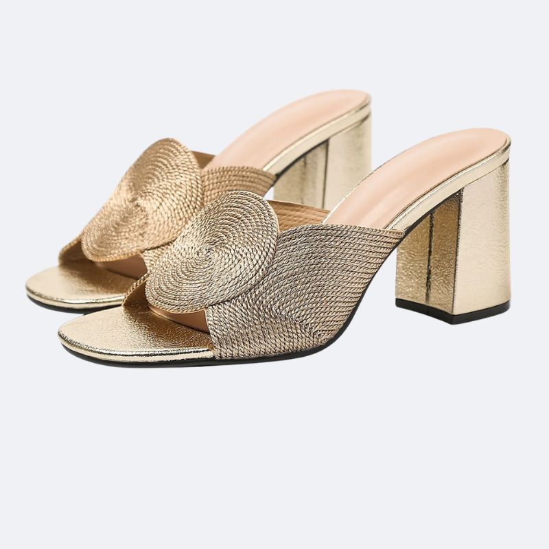 Close-up detail of premium knit fabric with gold thread on comfortable women’s high heels