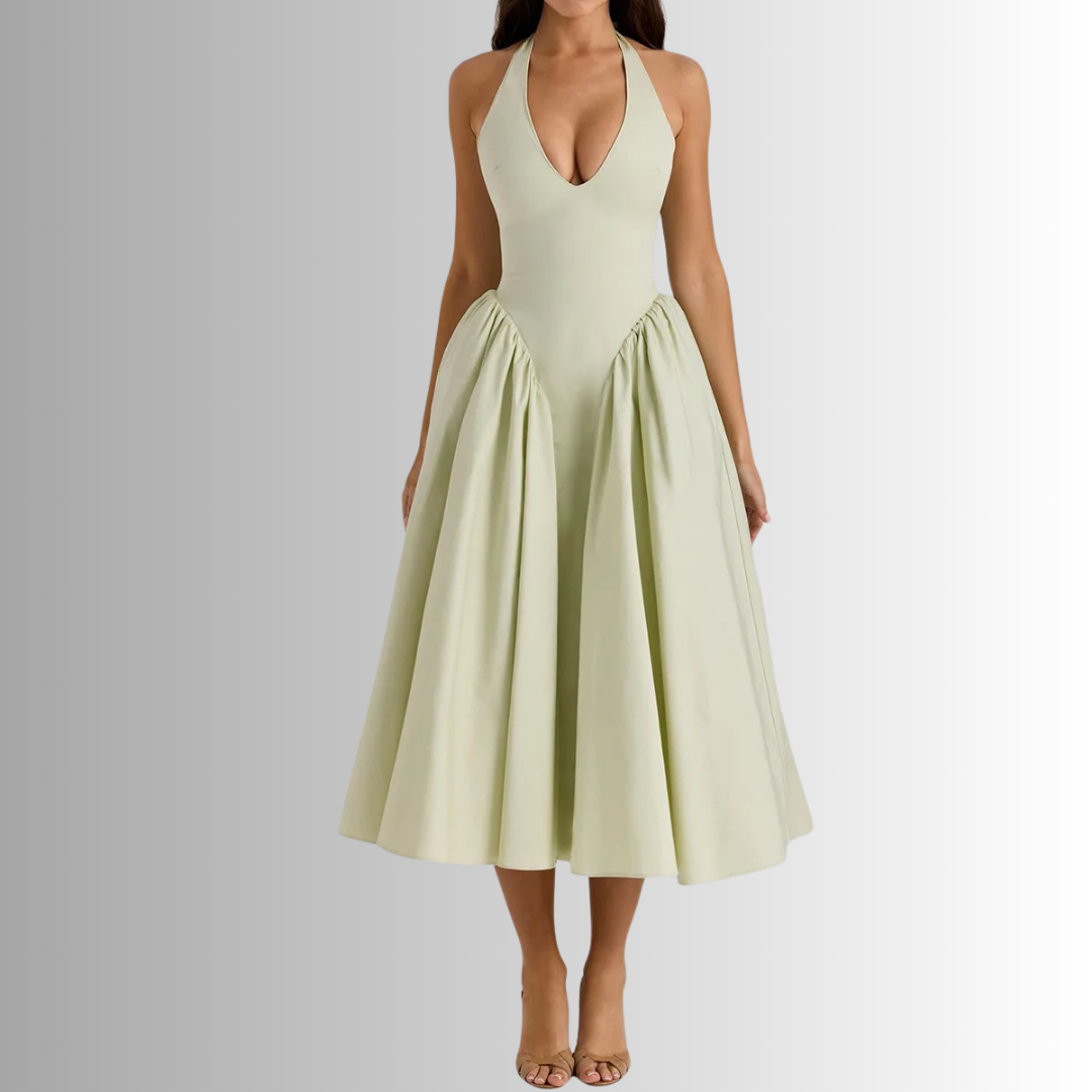 Model wearing  green halter midi dress with open back