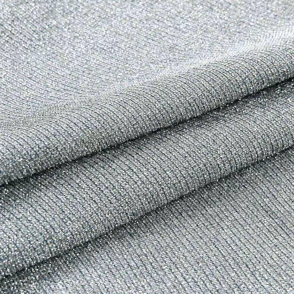 Close-up detail of sparkling sequins on women’s shiny top