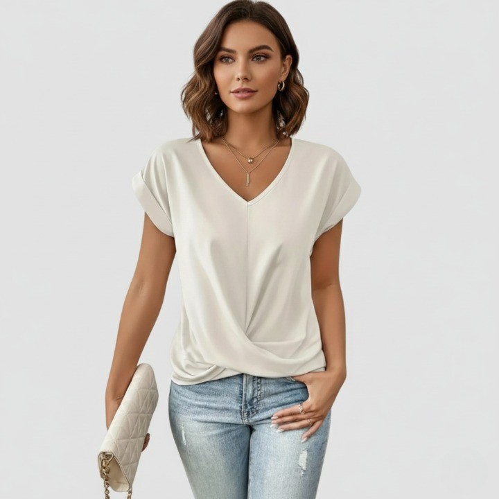 White women’s flowy V-neck top with an elegant and comfortable fit, perfect for a chic and relaxed everyday look