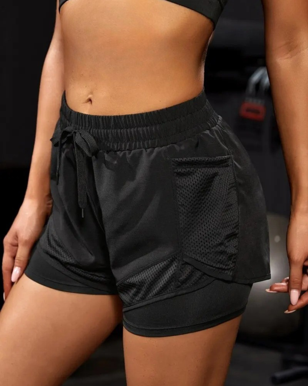 High-waist black yoga shorts with side pockets