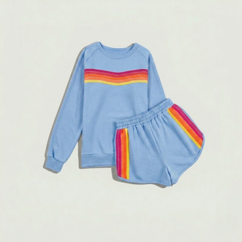 Close-up detail of colorful contrast stripes on blue oversized women’s sweatshirt