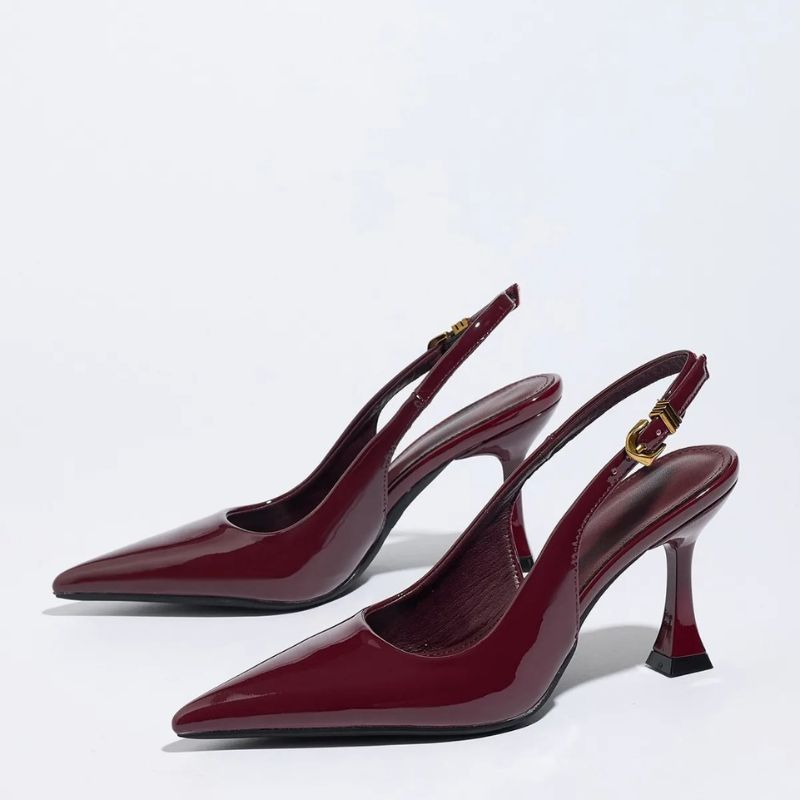 Close-up detail of glossy burgundy patent finish on women’s pumps