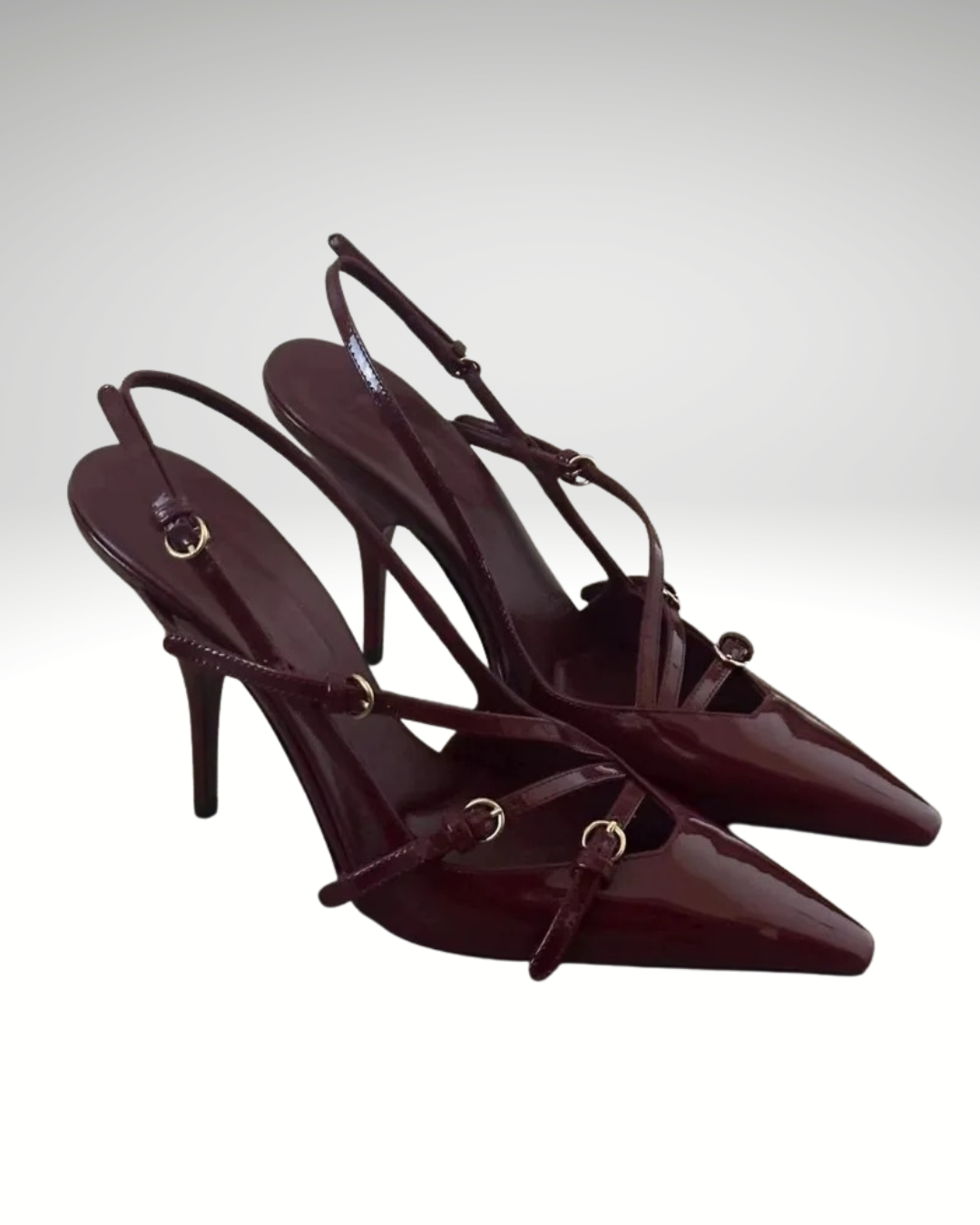 Detail of straps and buckle on burgundy patent women’s heels