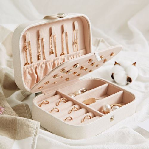 Open jewelry box with rings and necklaces