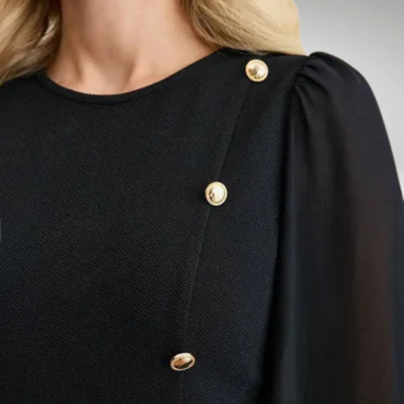 Decorative pearl details on elegant women’s mini dress