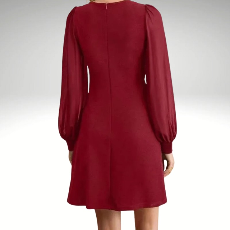 Back view of elegant women’s trapeze mini dress