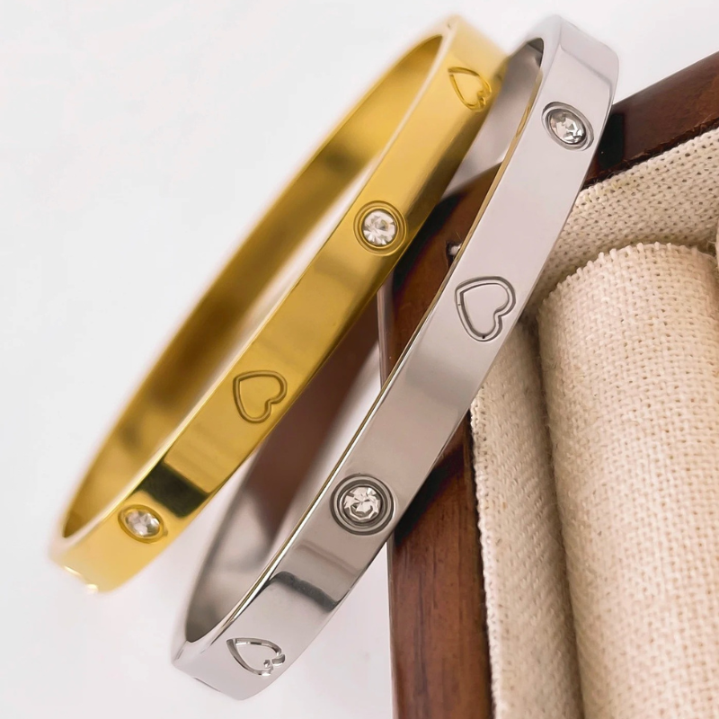 Ella Gold Bangle Bracelet stacked with other elegant gold bangles