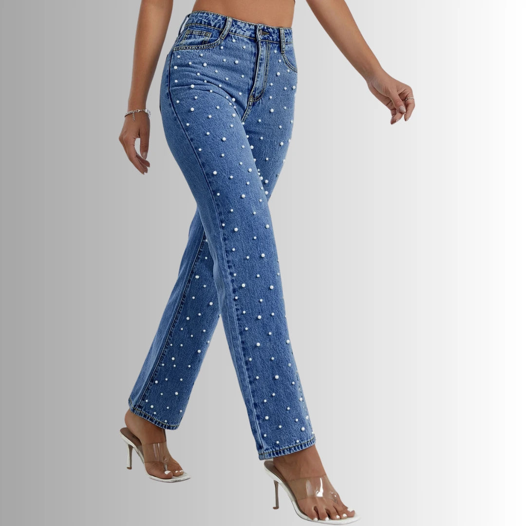 Trendy women’s look featuring Aurora Beaded Denim jeans, white crop top, and transparent sandals