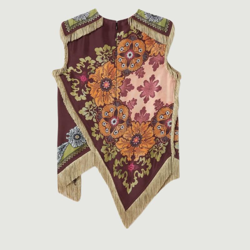 Close-up detail of the fringe accents and vintage floral print on a satin women’s top