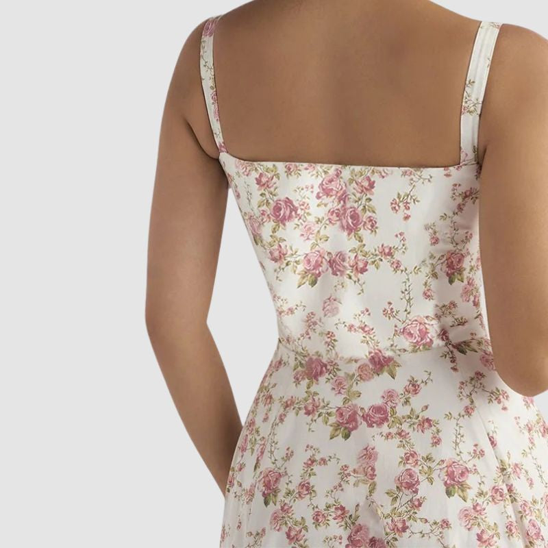 Close-up back view of elegant floral midi dress for women highlighting the fitted bodice and floral print details