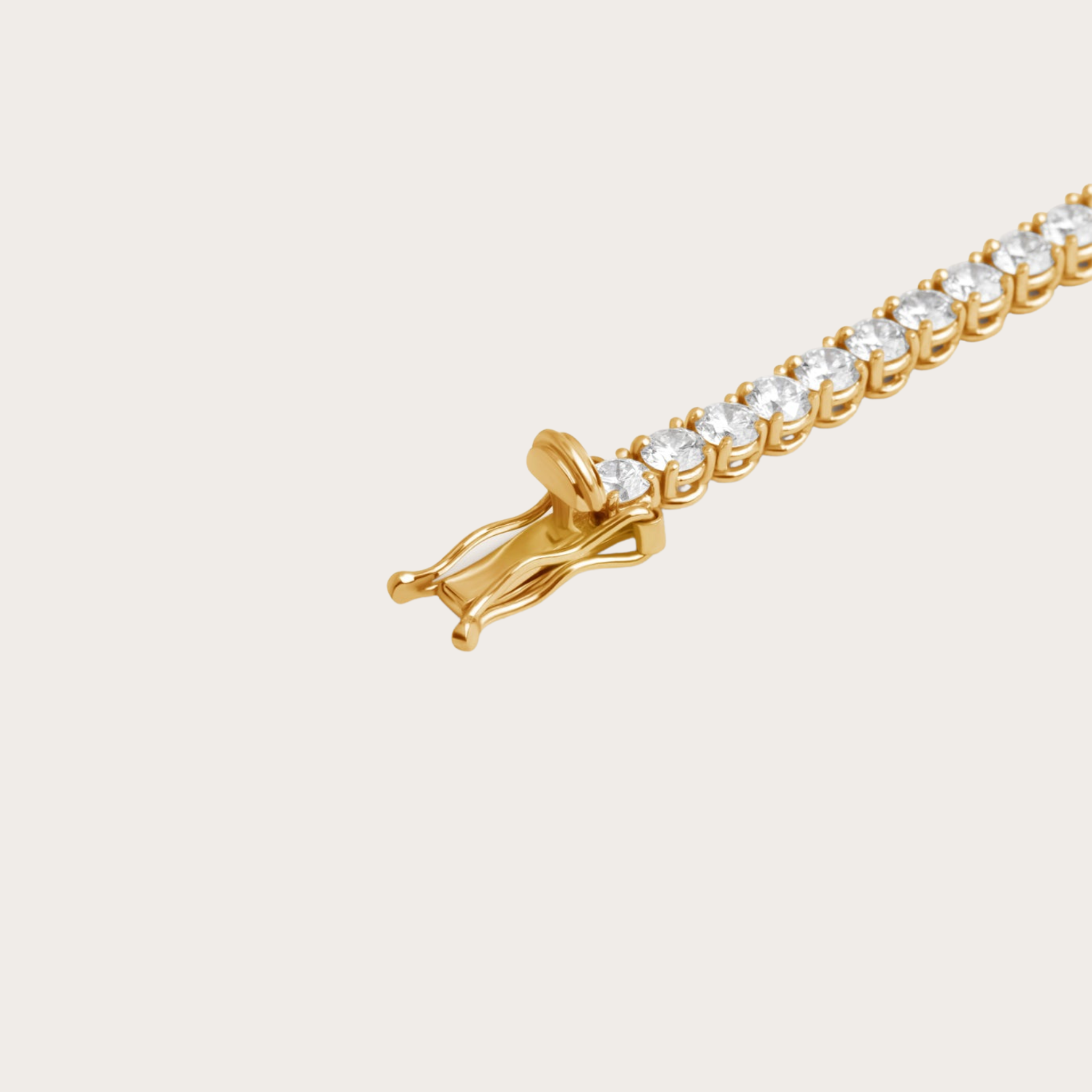 Detailed view of the gold tennis bracelet clasp, secure fastening with radiant cubic zirconia