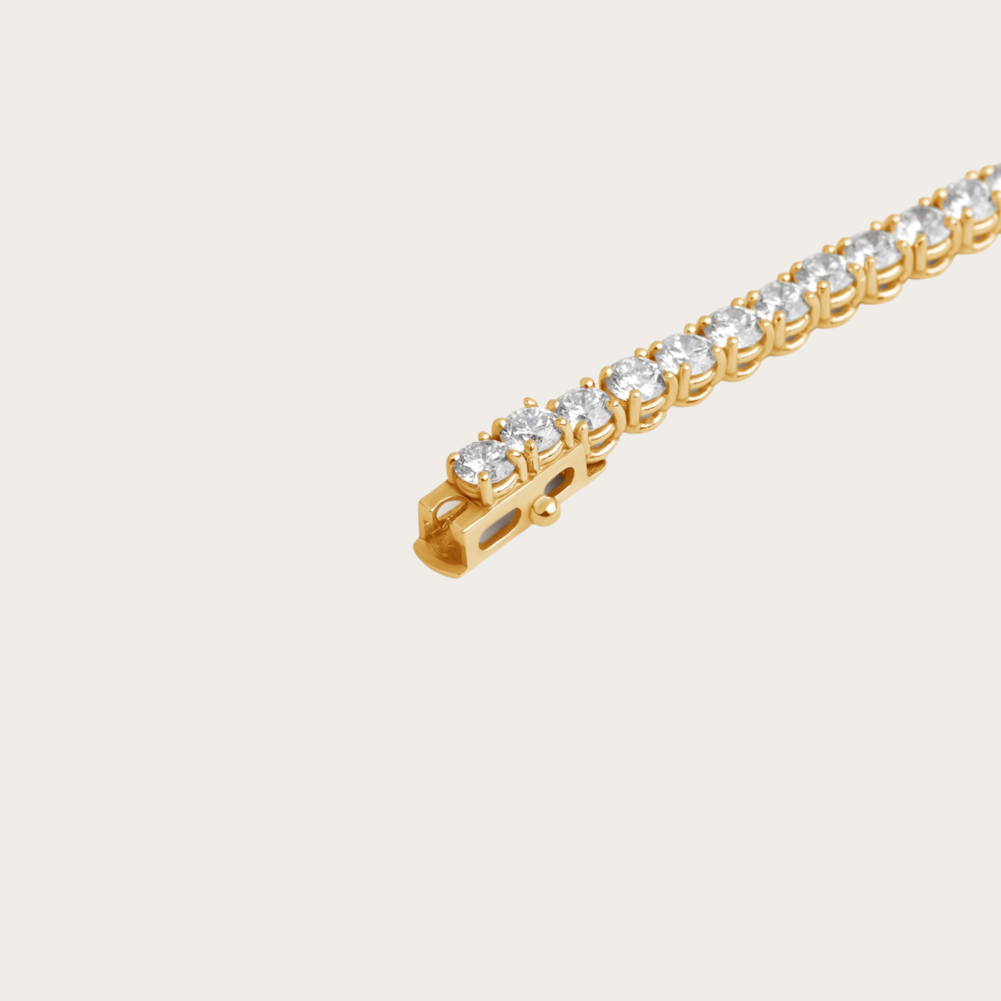Detailed view of the gold tennis bracelet clasp, secure fastening