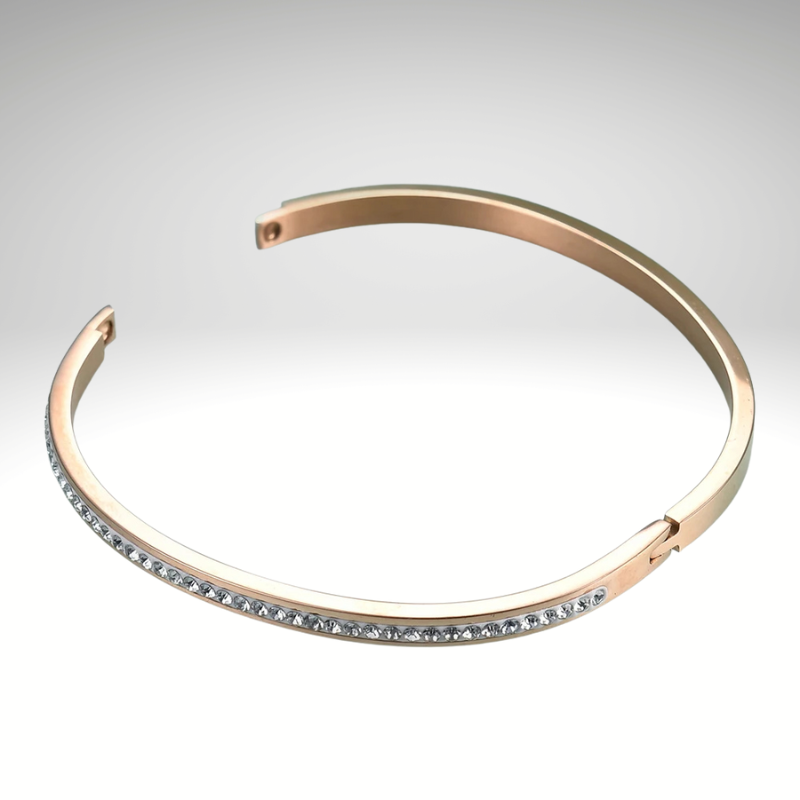 Woman wearing the Isla Bracelet – chic gold nail bangle with sparkling zirconia, stylish fashion accessory