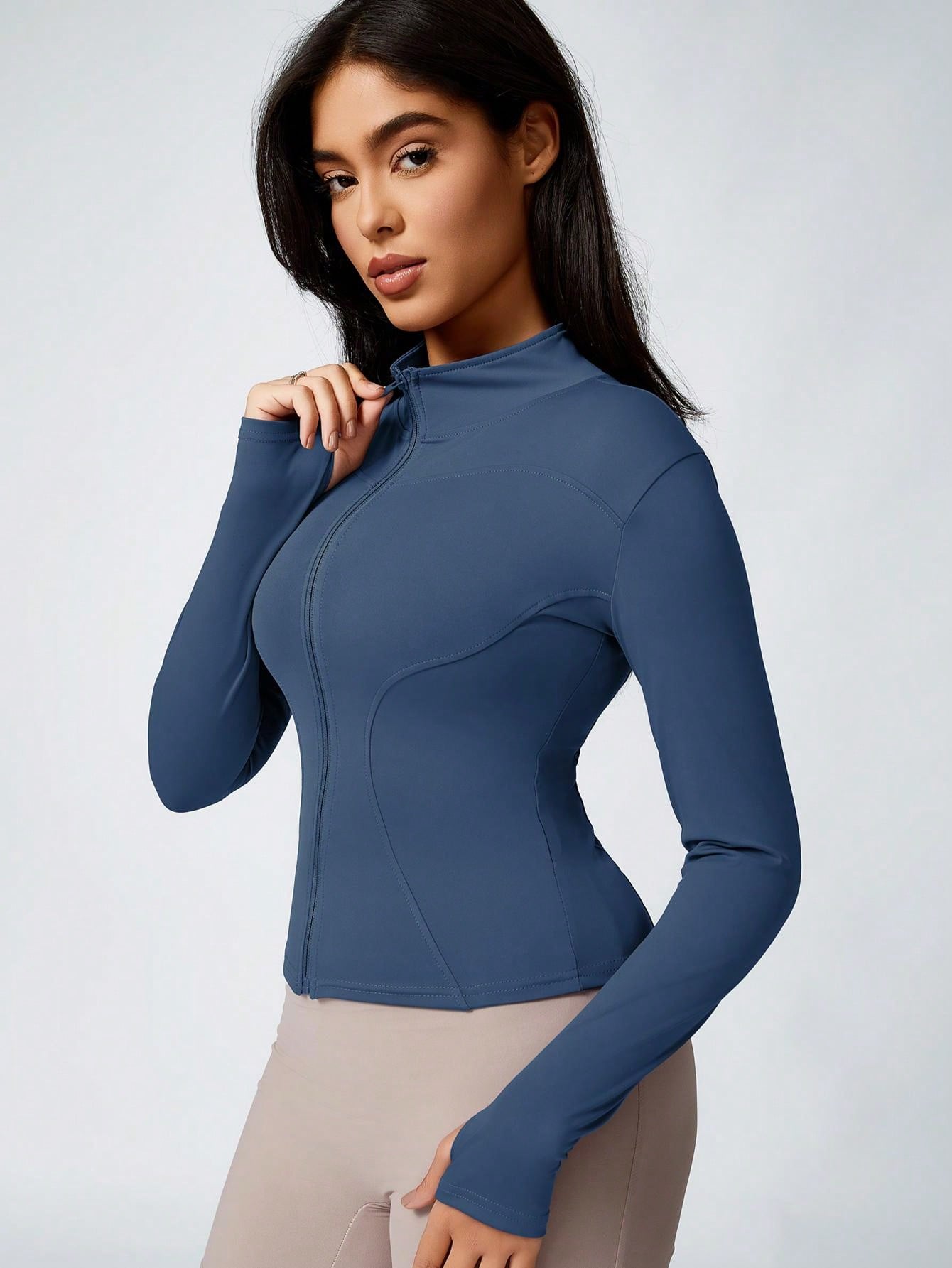 Blue women’s activewear jacket with long sleeves