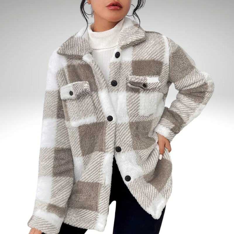 Button and lapel detail of women’s plaid coat, blended wool