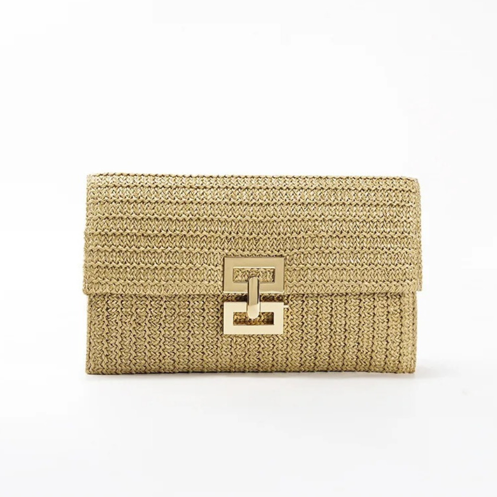 Close-up detail of the elegant gold buckle on the Raya woven clutch