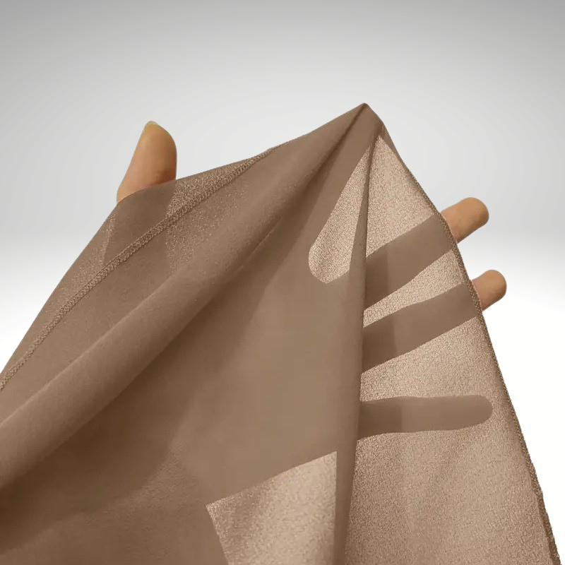 Detail of layered cape sleeves on women’s silk chiffon blouse