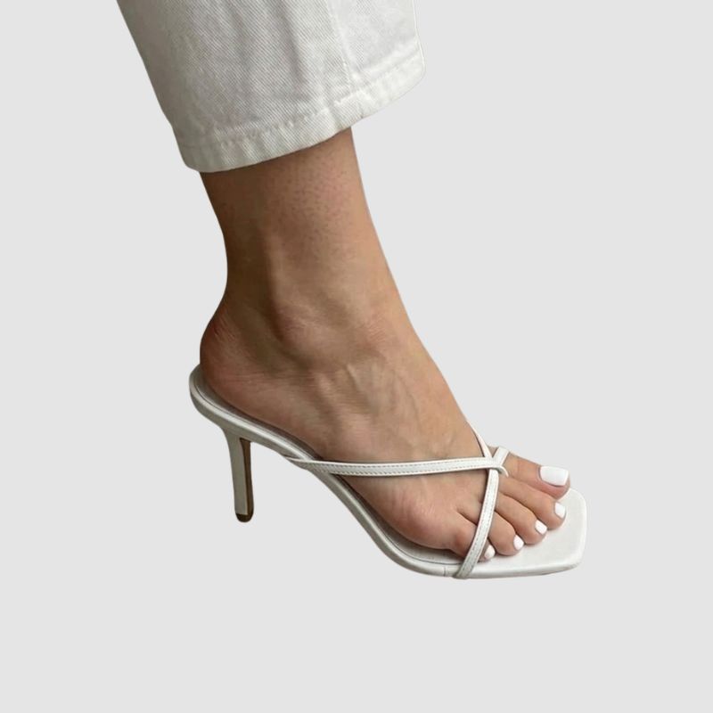 Close-up detail of white crossover straps