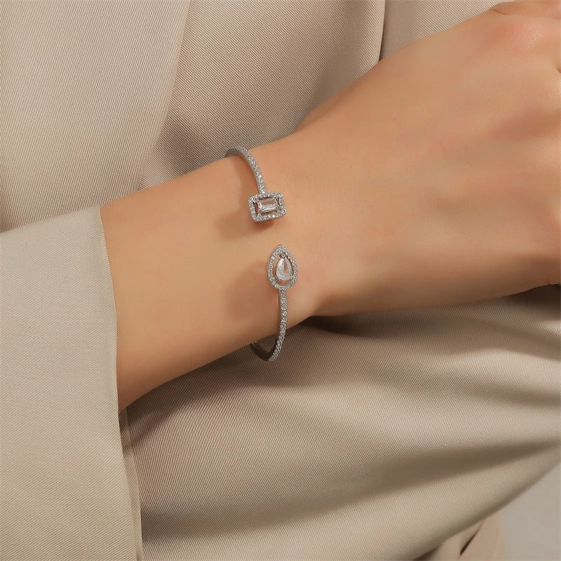 Woman wearing Ophelia Silver Minimalist Bangle Bracelet on wrist