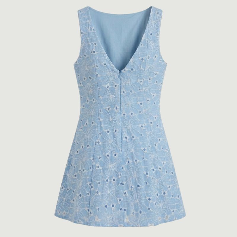 close-up back view of women’s blue summer dress highlighting elegant cut and refined finishing details