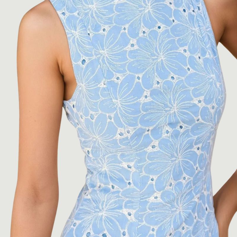 close-up embroidery detail on women’s blue summer dress with elegant finish