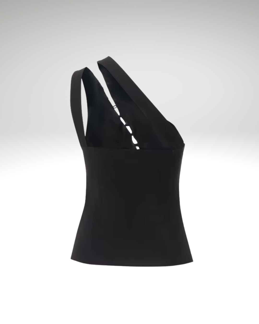 Close-up detail of black asymmetrical women’s sleeveless vest fabric and button fastening
