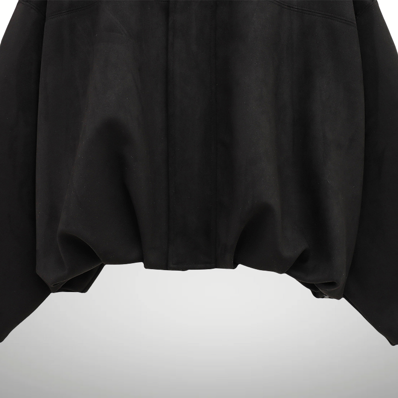 Women’s black bomber jacket styled with jeans streetwear