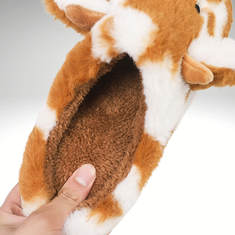 Women’s brown cow print cozy indoor slippers with warm lining close up 
