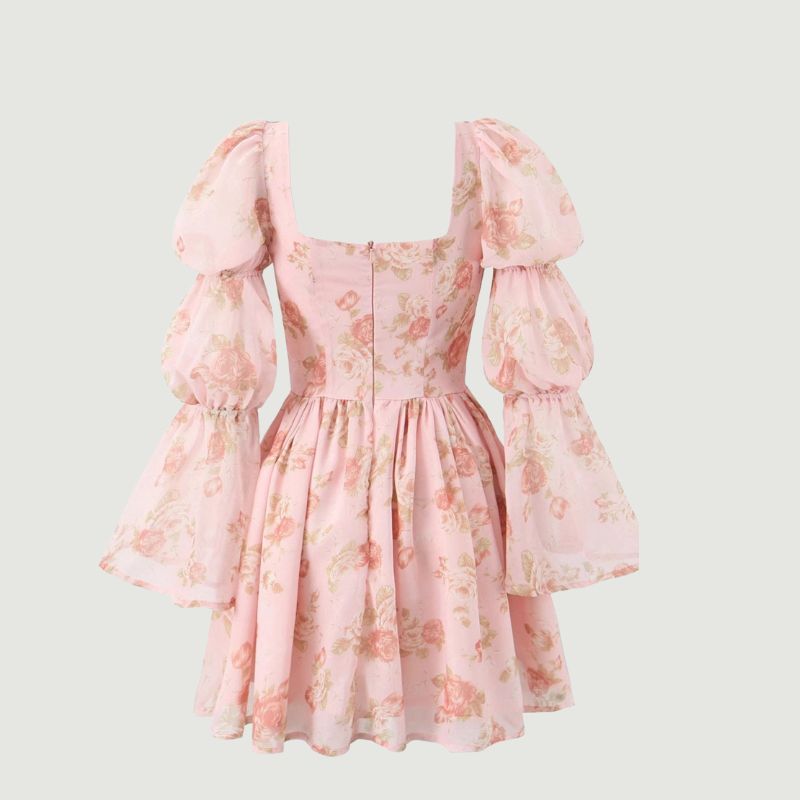 Close-up detail of floral print on elegant women’s mini dress
