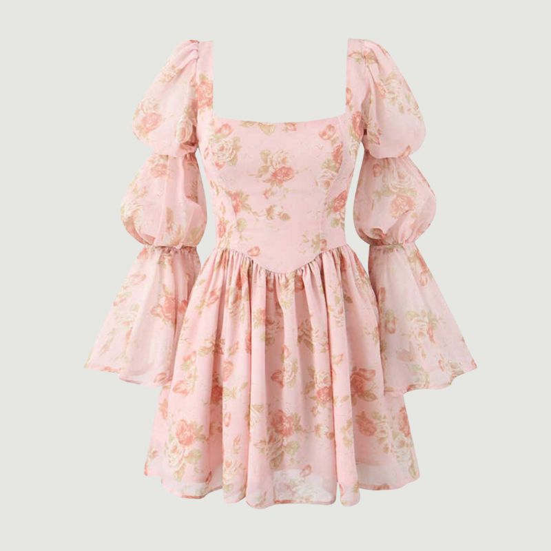 Close-up detail of floral print on elegant women’s mini dress