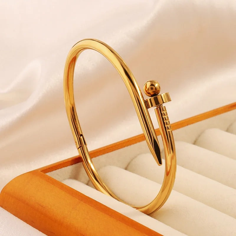 Women’s gold stainless steel bracelet with elegant round beads close up 