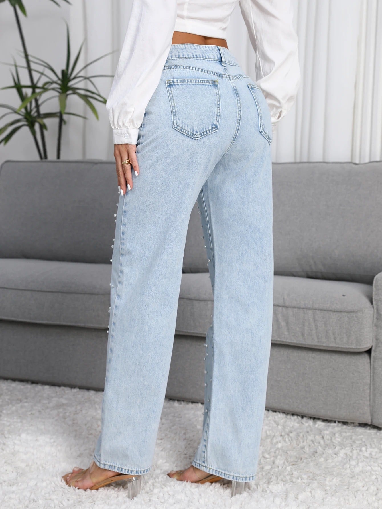 Women’s straight-leg jeans in light blue with pearl embellishments view back 