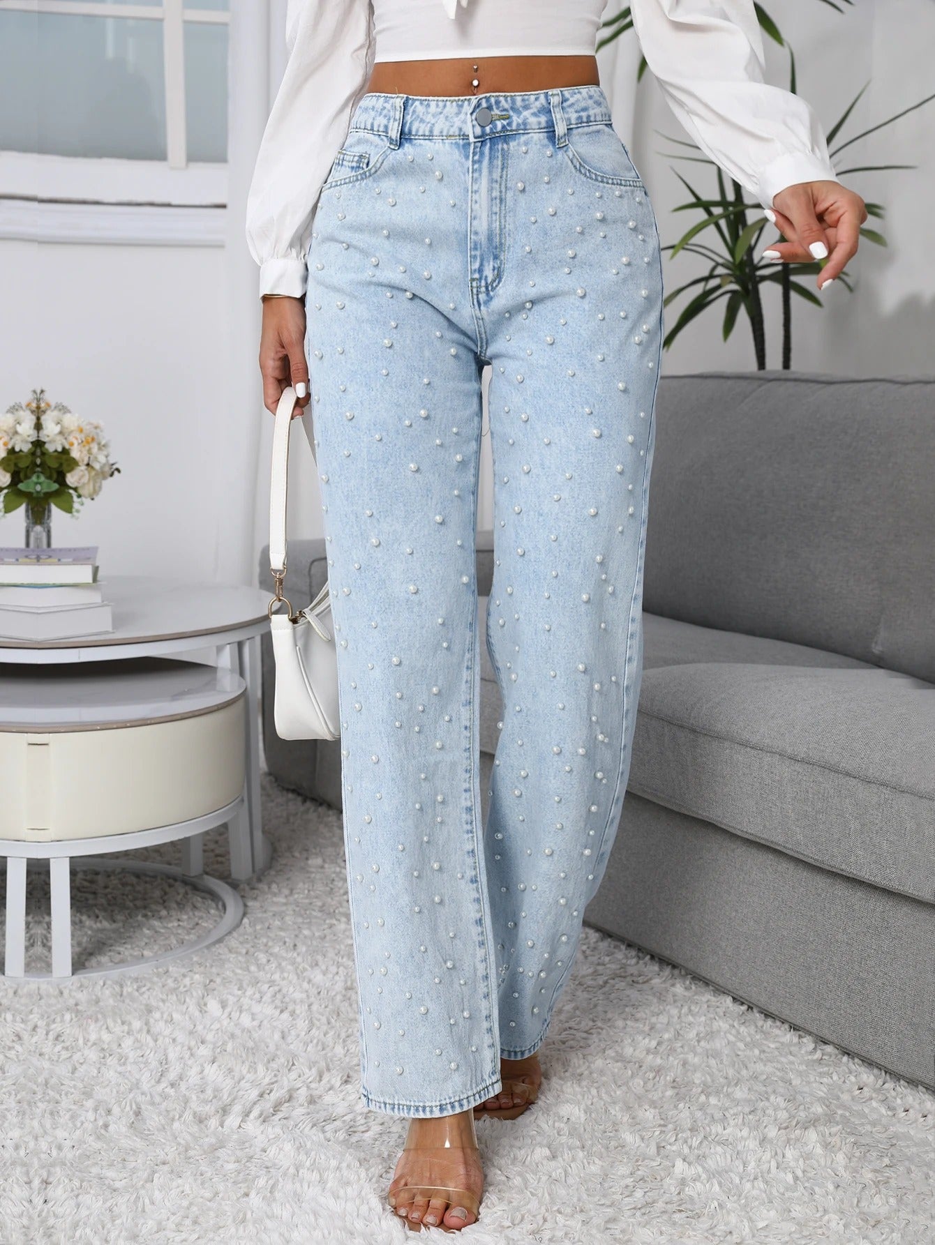 Women’s straight-leg jeans in light blue with pearl embellishments