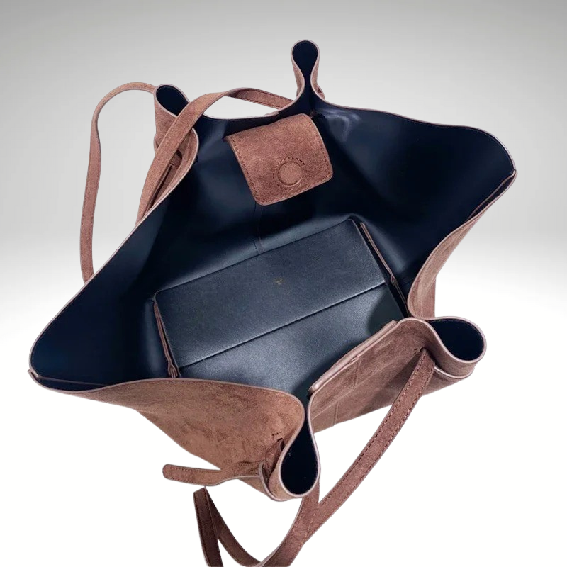 Interior of large capacity tote bag with laptop and documents