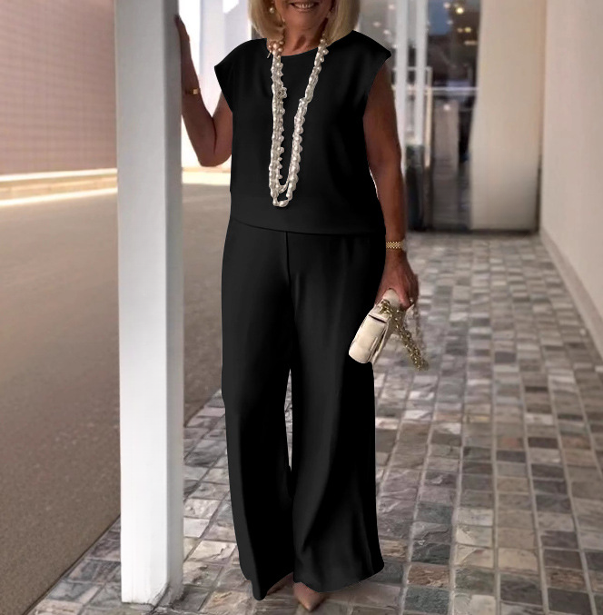 Elegant black two-piece women’s pants set – chic office outfit for summer.