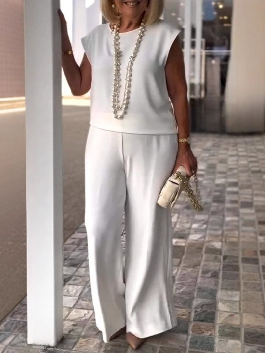 White chic women’s two-piece set – sleeveless round-neck top and high-waist flowy pants.