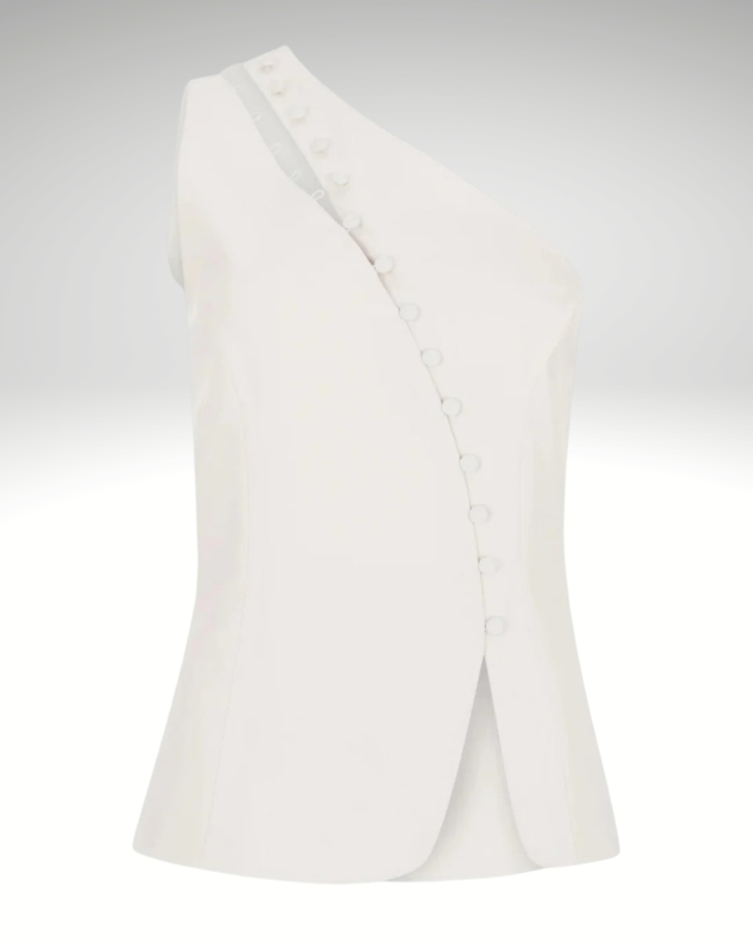 Close-up detail of white asymmetrical women’s sleeveless vest fabric and button fastening