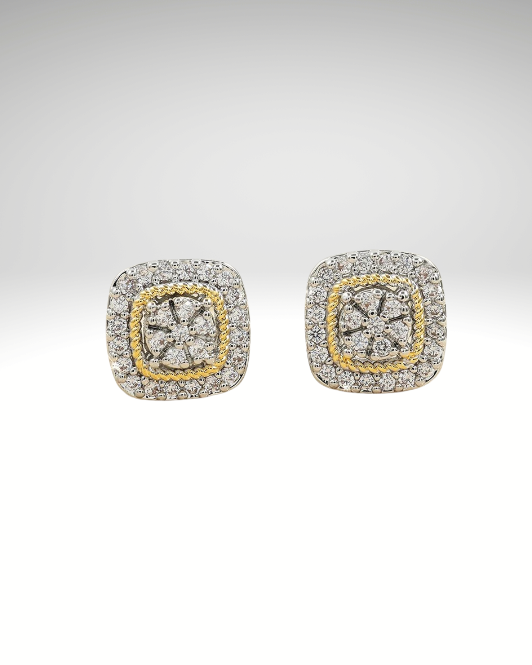 Lifestyle display of geometric zircon earrings in gold and silver tones on a neutral background