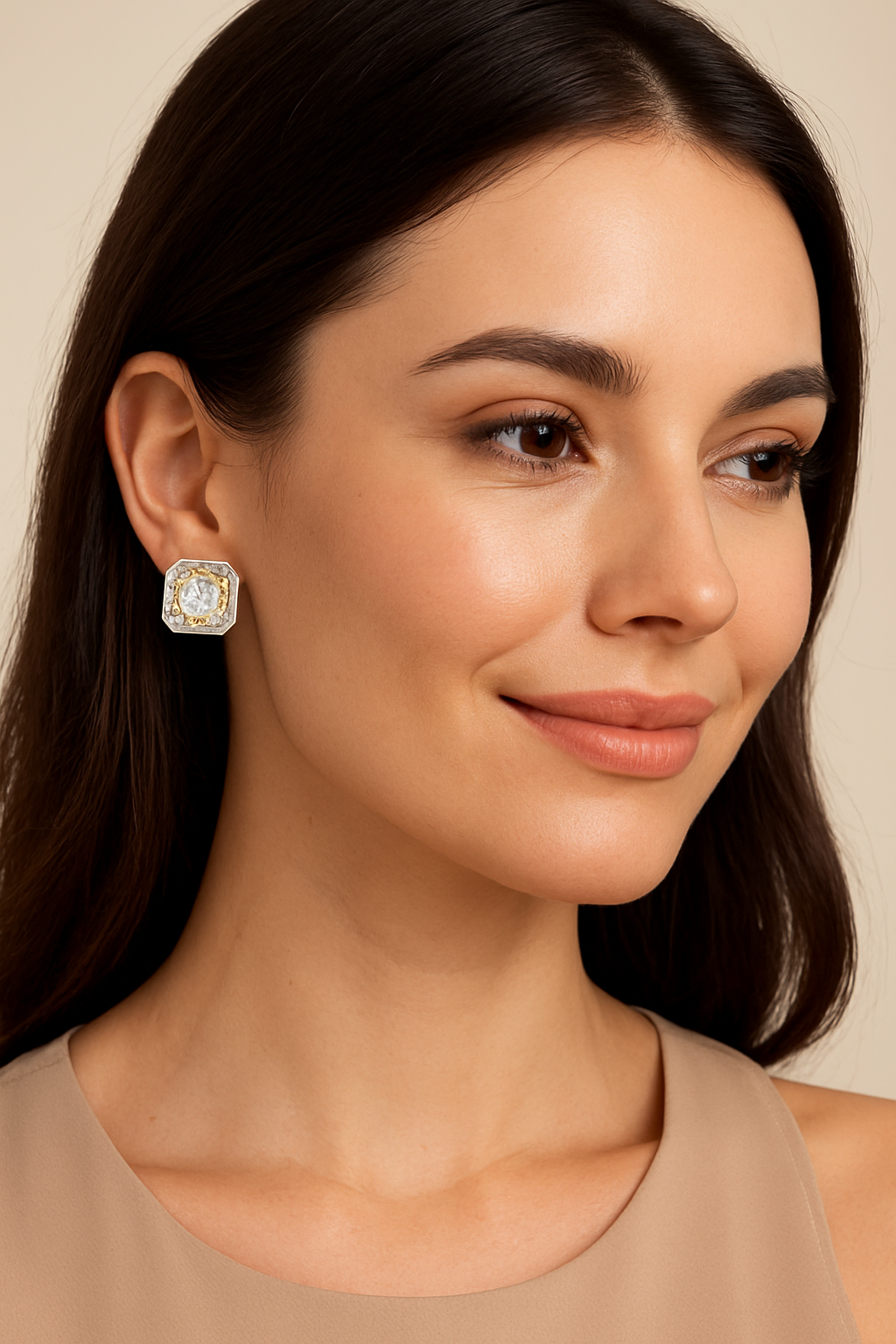 Elegant woman wearing geometric zircon earrings in gold and silver tones